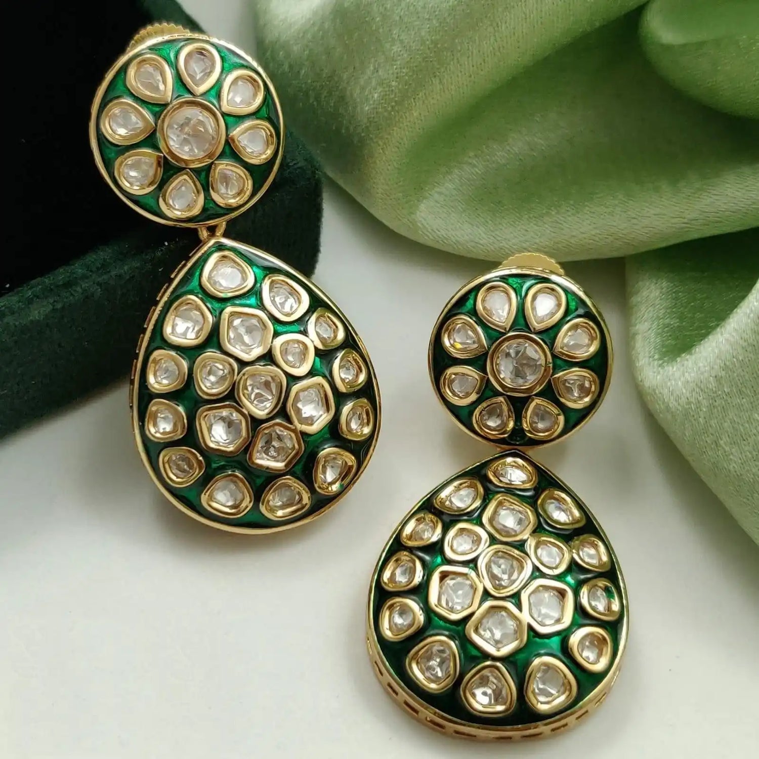 Green and gold gemstone earrings.
