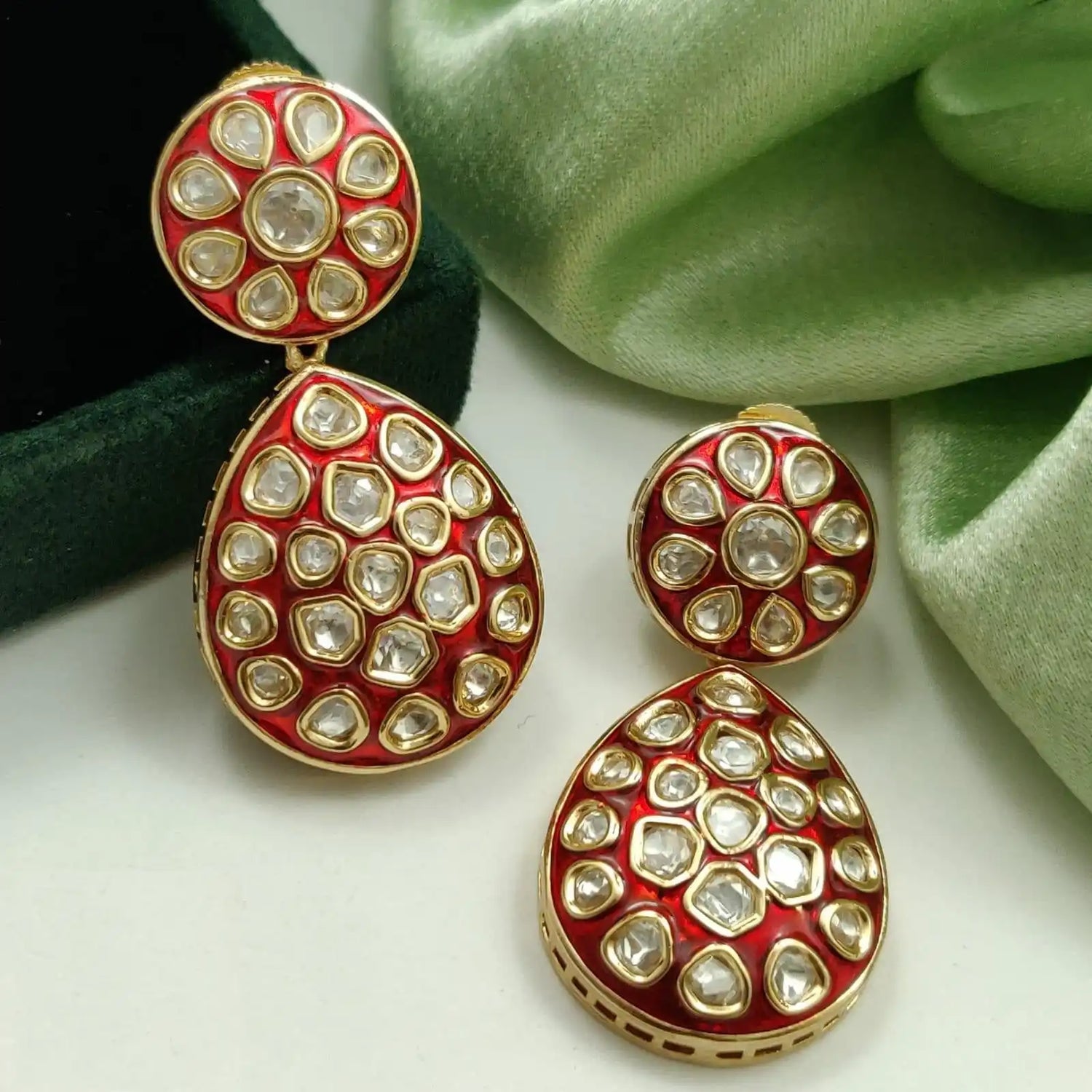 Red and gold Polki diamond jewelry set.